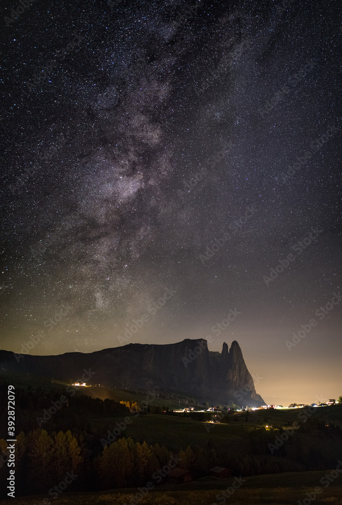 Milky Way and starry sky at night on the Alps di Siusi, Seiser Alm in Dolomites, Italy