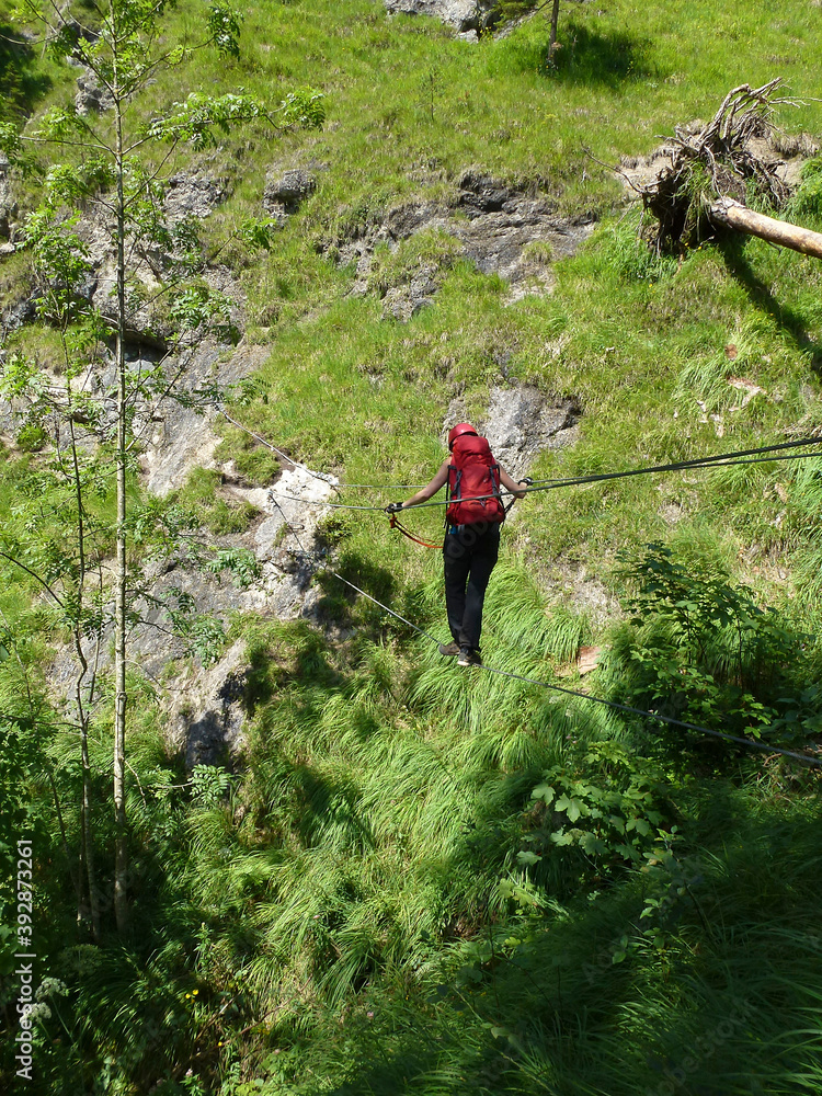 Climer at Hausbachfall via ferrata in Bavaria, Germany Climer at Hausbachfall via ferrata in Bavaria, Germany