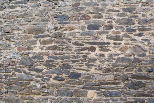 Old stone wall background texture with copy space