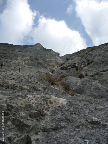 Climber at Kaiser Max via ferrata in Tyrol, Austria