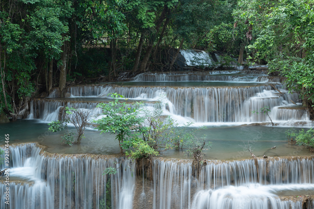 Obraz premium Huay Mae Khamin waterfalls in deep forest at Srinakarin National Park ,Kanchanaburi ,A beautiful stream water famous rainforest waterfall in Thailand