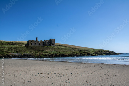 Abandoned coast guard station located near Howes strand, a small lonely beach close to Kilbrittain, Co. Cork. The Howe Strand Coastguard and Telegraph Station was burnt down by the IRA in 1920. photo