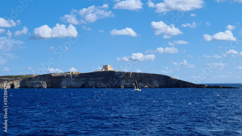 The small island of Comino sits between Malta and Gozo. Also seen is St. Mary s Tower also known as Comino Tower built in 1618. It was the 5th Wignacourt tower built by the Order of Saint John.