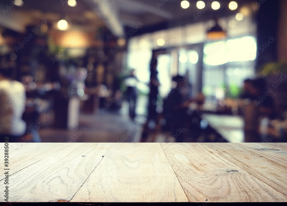 wood table on blur of cafe, coffee shop, bar, resturant, background - can used for display or montage your products wood table on blur of cafe, coffee shop, bar, resturant, background - can used for display or montage your products