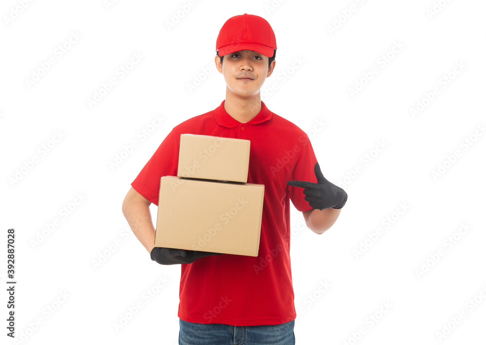 Young Delivery man in red uniform holding paper cardboard box mockup isolated on white background with clipping path. Young Delivery man in red uniform holding paper cardboard box mockup isolated on white background with clipping path.