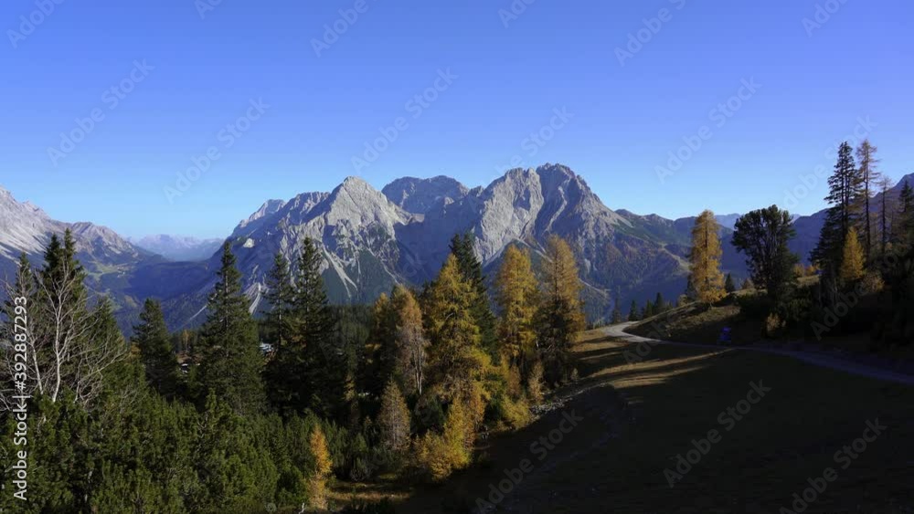Panning view showing a mountain hiking path in the alps in autumn. Grubigstein, Lermoos, Ehrwald, Tyrol, Austria Panning view showing a mountain hiking path in the alps in autumn. Grubigstein, Lermoos, Ehrwald, Tyrol, Austria