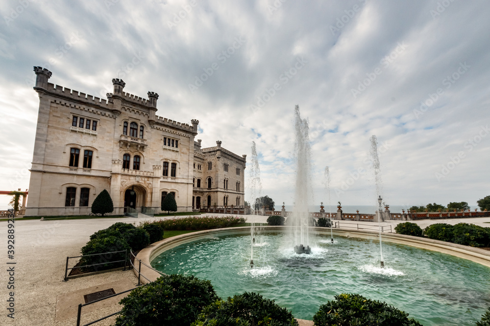 Italian castle on the Adriatic Sea in the Gulf of Trieste, view with the large fountain in the foreground