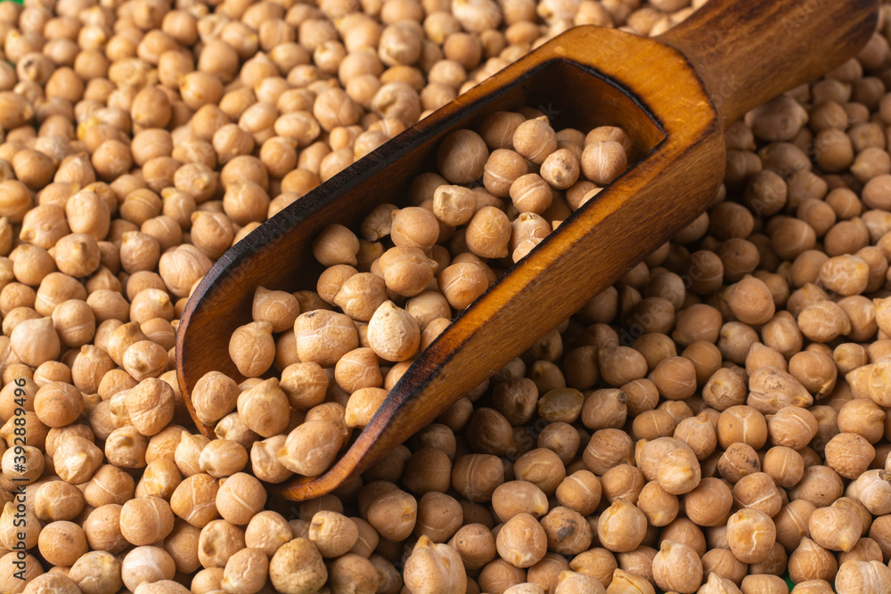 Wooden scoop with chickpea. Food concept. Healthy and wholesome food. Wooden scoop with chickpea. Food concept. Healthy and wholesome food.