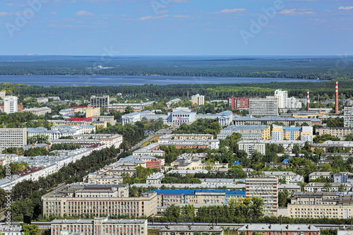 Aerial view of the east side of Yekaterinburg, Russia, with main building of the Ural Federal University and Shartash Lake. View from observation deck of Vysotsky skyscraper at 186 m above the ground. photo