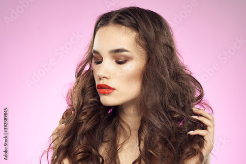 Woman with hairstyle and red lips naked shoulders bright makeup attractive look