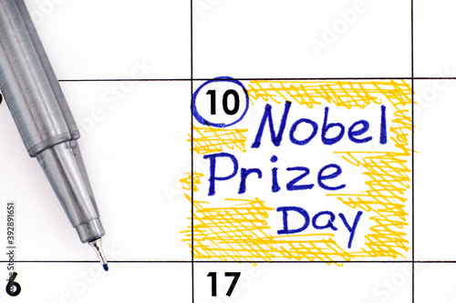 Reminder Nobel Prize Day in calendar with pen photo