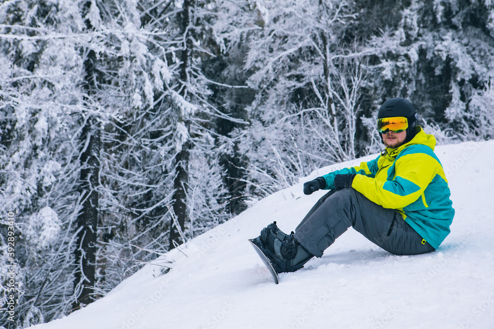 man strap in snowboard. winter sport activities