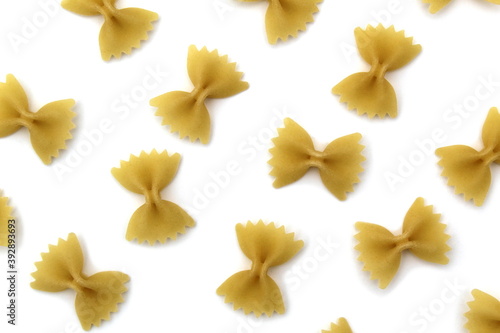 Texture of pasta bows on a white background