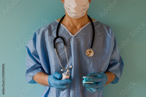 A doctor with a stethoscope and thermometer
 photo