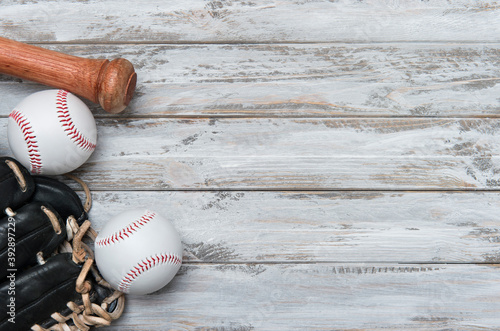 Photography Baseball bat, glove and ball on wooden background