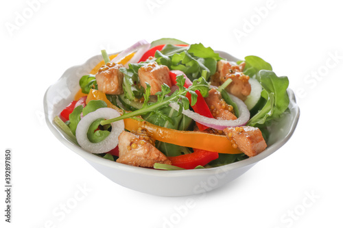 Delicious fresh chicken salad with vegetables and arugula isolated on white