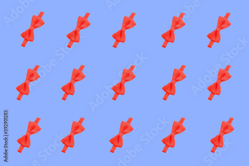 red bow pattern. red bow on a blue background. ribbon