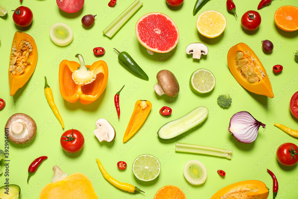 Flat lay composition with fresh organic fruits and vegetables on light green background Flat lay composition with fresh organic fruits and vegetables on light green background