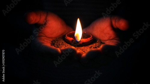 Diya for diwali celebration lighting the lamp in diwali in indian light festival
