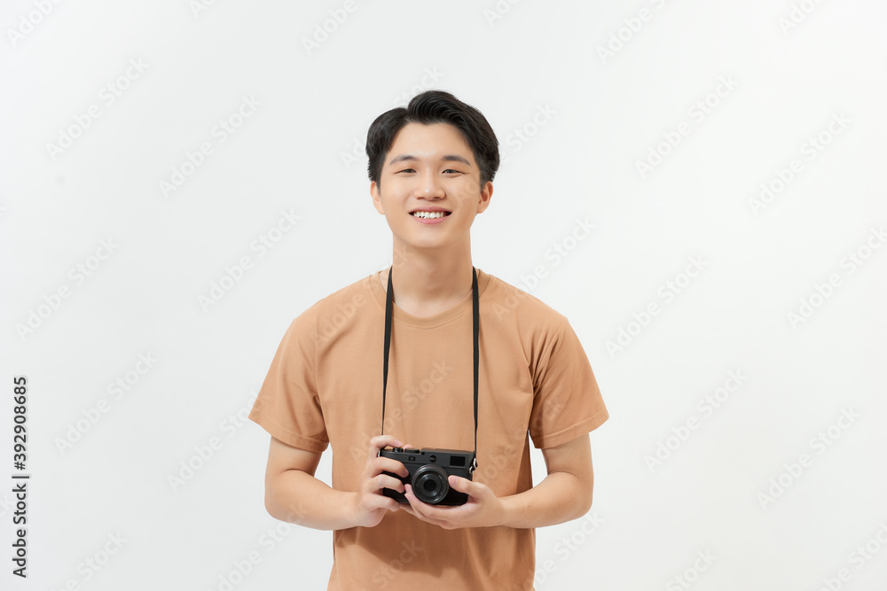 Happy young asian hipster photographer man in casual fashion using vintage camera freedom lifestyle travel concept Happy young asian hipster photographer man in casual fashion using vintage camera freedom lifestyle travel concept