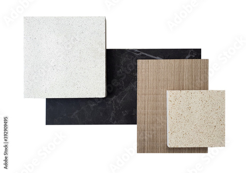 top view ,composition of interior finishing material including white and beige grained quartz stone ,ash wood veneer ,black cosmos  quartzite stone samples isolated on white background. photo