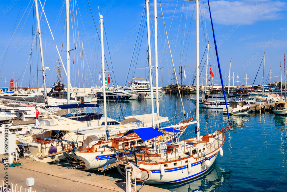White yachts in the sea harbor of Kemer, Antalya province in Turkey. Kemer Marina on the Mediterranean sea White yachts in the sea harbor of Kemer, Antalya province in Turkey. Kemer Marina on the Mediterranean sea