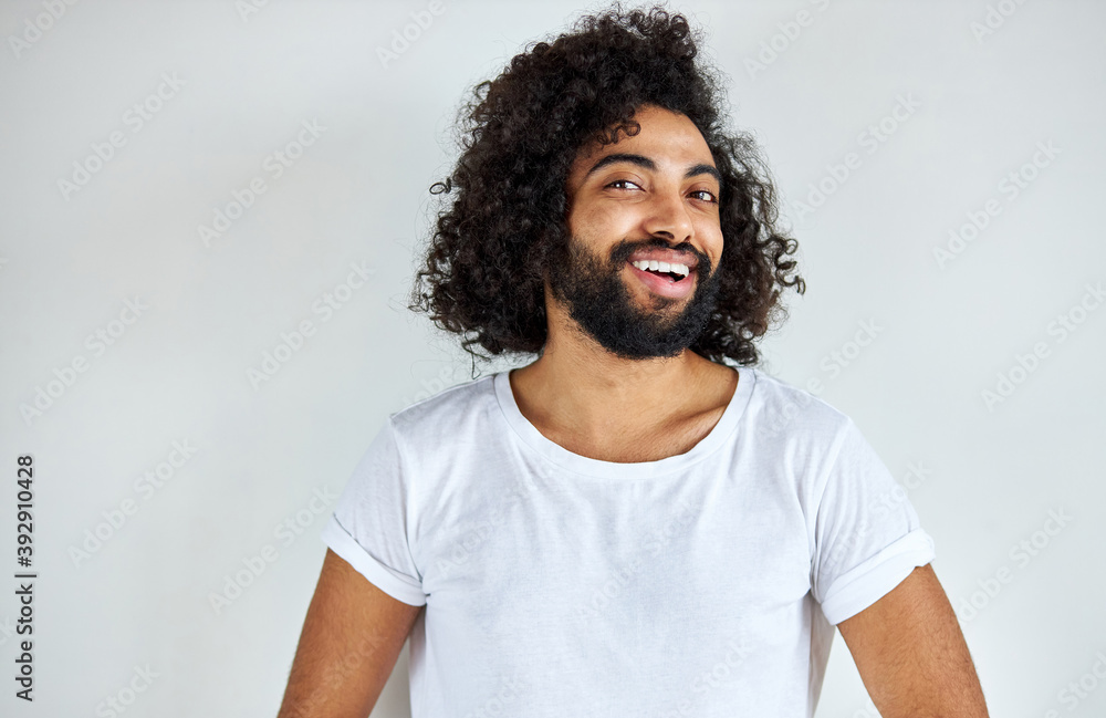 happy man cheerfully smiling isolated in studio with white background, arabic positive guy posing happy man cheerfully smiling isolated in studio with white background, arabic positive guy posing