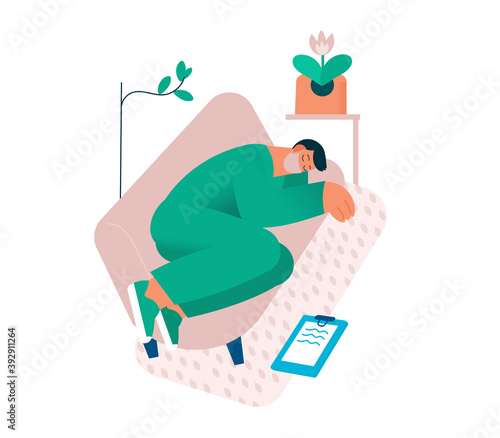 Tired overworked doctor or nurse sleeping on the couch. Exhausted Healthcare worker. Coronavirus pandemic, Covid-19 quarantine.