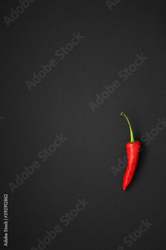 red chilli pepper on black background