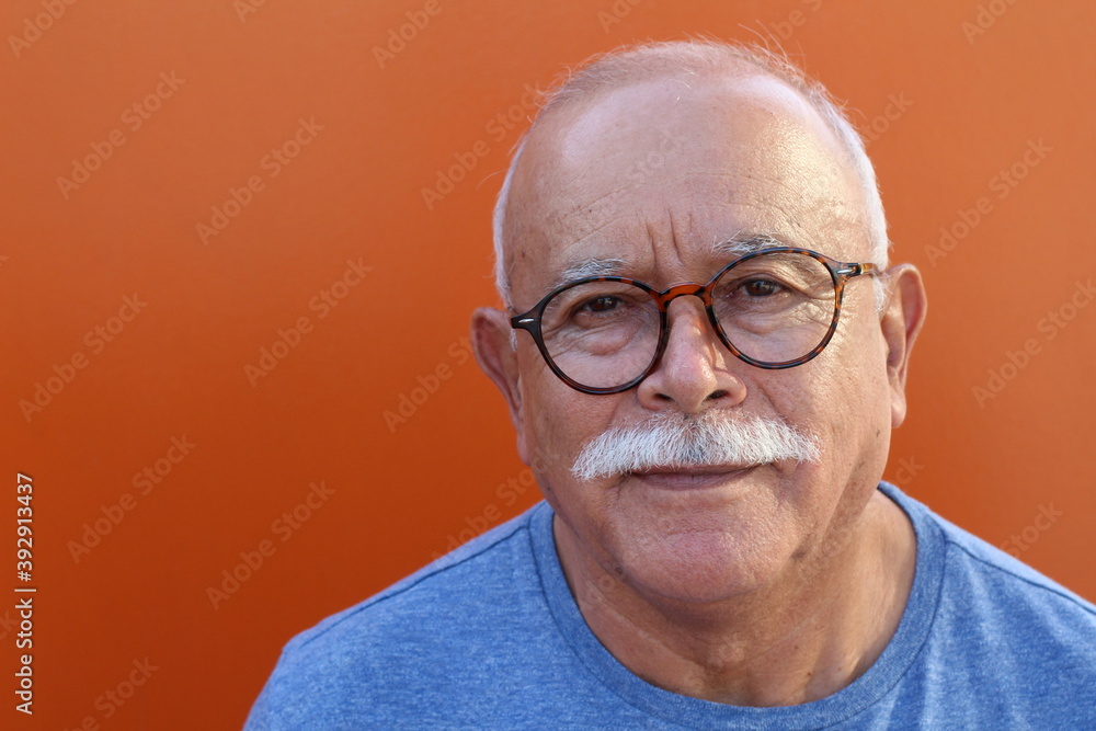 Ethnic senior man with a mustache and eyeglasses Ethnic senior man with a mustache and eyeglasses