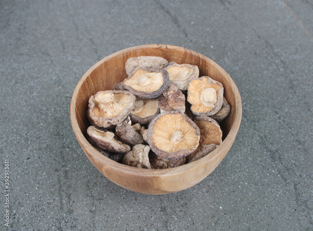shitake mushrooms in a wood bowl shitake mushrooms in a wood bowl