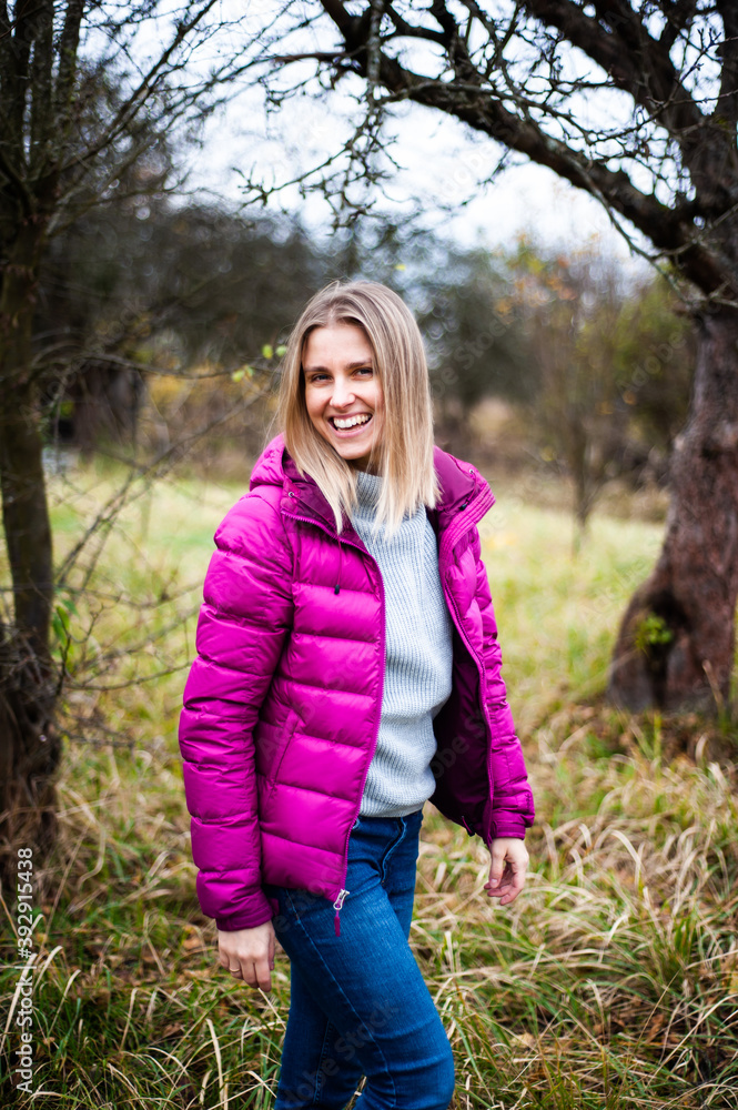 Smiling blonde woman autumn outdoor Smiling blonde woman autumn outdoor