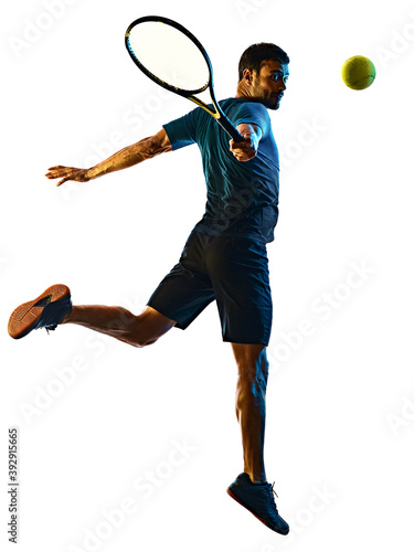 one caucasian mature man Tennis Player shadow silhouette in studio isolated on white background