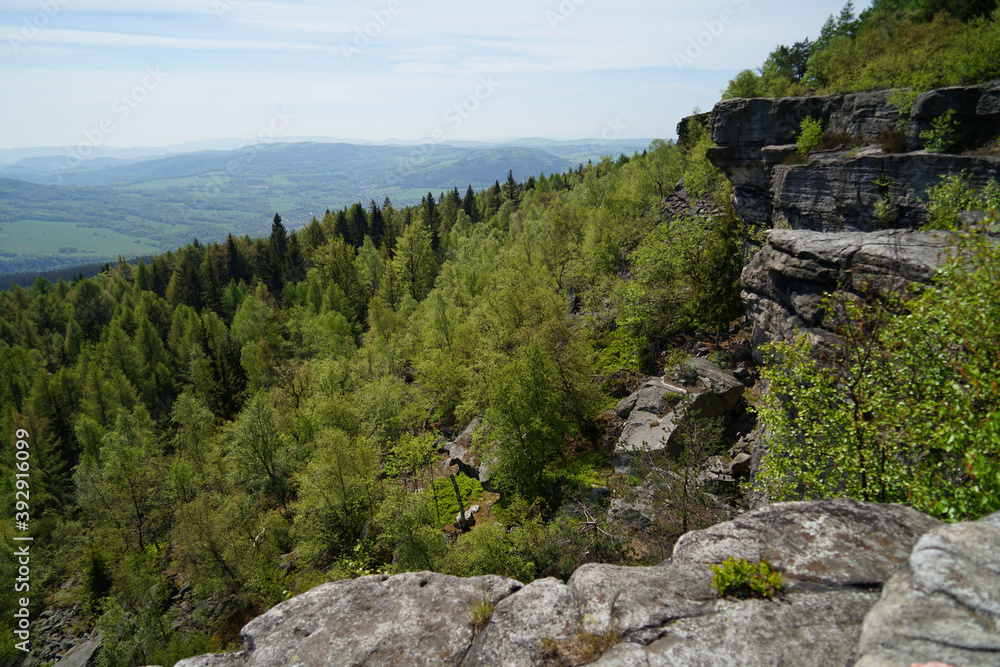 Decinsky Sneznik mountain with panoramic aerial view from rock plateau above forest, Czech Republic