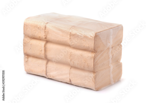 Foto Packed organic pressed sawdust fuel briquettes