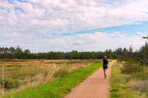 A person jogging in nature.