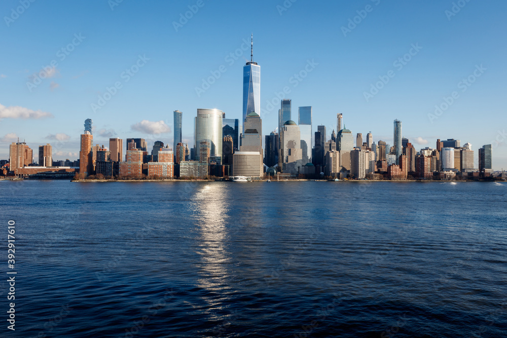 New York City Manhattan skyline daytime with One World Trade Center Tower (Freedom Tower)over Hudson River viewed from New Jersey