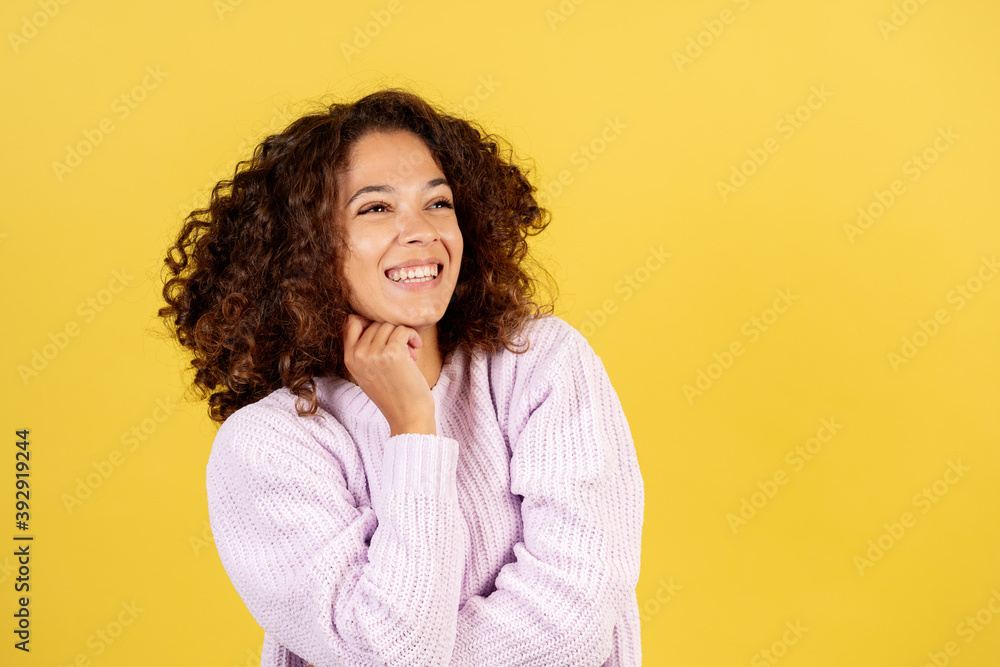Φωτογραφία Adult afro american woman on yellow copy space background