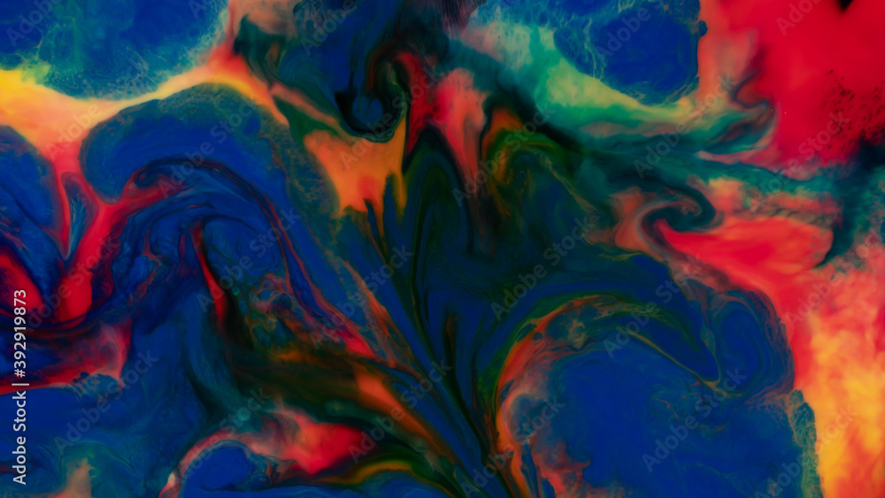 Abstract background of moving liquid paints close-up.