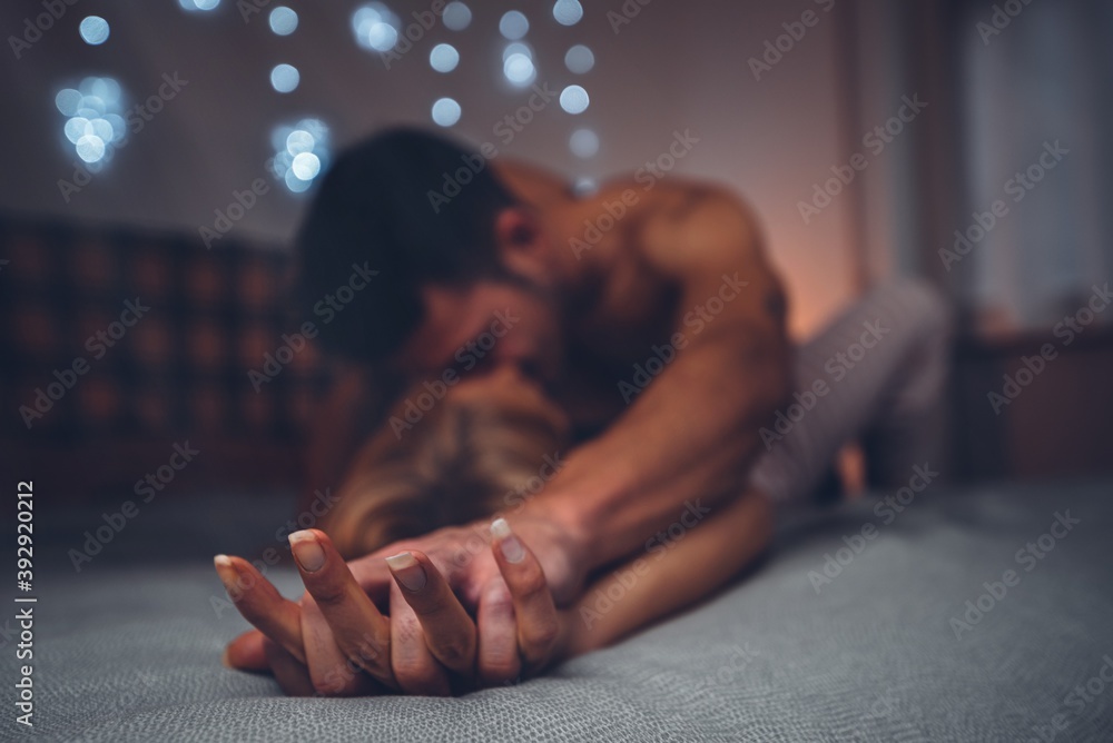 Φωτογραφία Couple in love kissing on the bed at home - Loving boyfriend and girlfriend shar