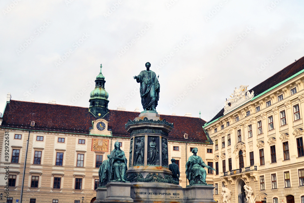 Famous Hofburg palace in Vienna, Austria. A sculptural composition in the center. Latin inscription 