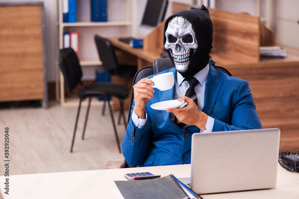 Devil businessman working in the office Devil businessman working in the office