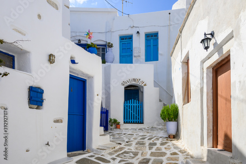 Typical Greek house with blue windows and doors on whitewashed street in beautiful Lefkes village on Paros island. Cyclades, Greece