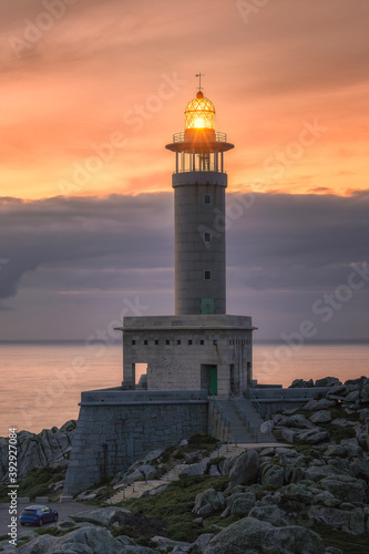vertical image of punta nariga lighthouse at sunset in galicia in spain © D.G.Eirin