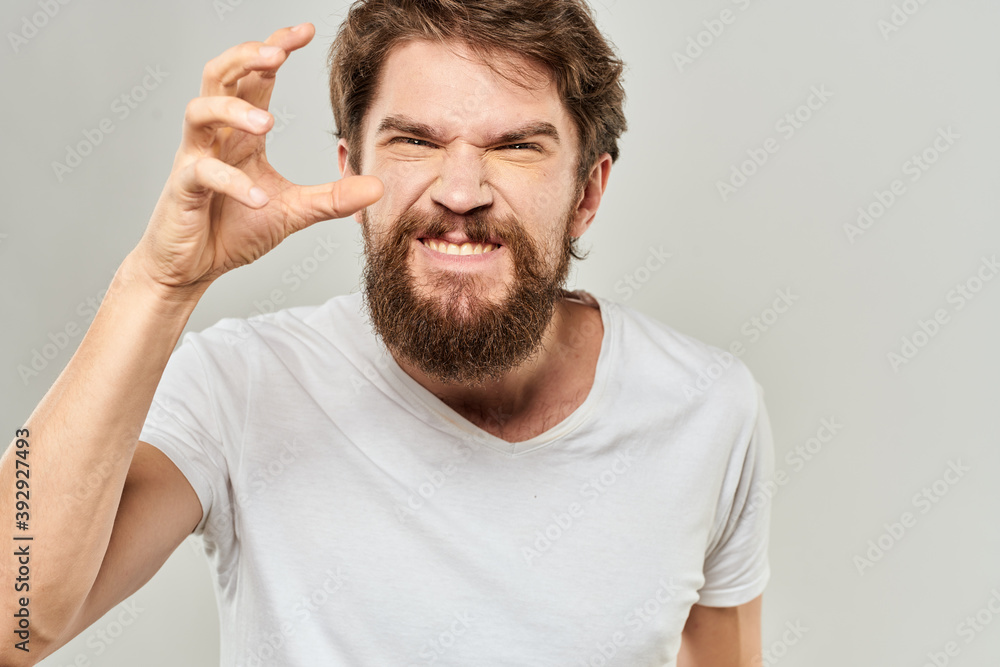 man in white t-shirt emotions expressions gesture with hands cropped view light background man in white t-shirt emotions expressions gesture with hands cropped view light background