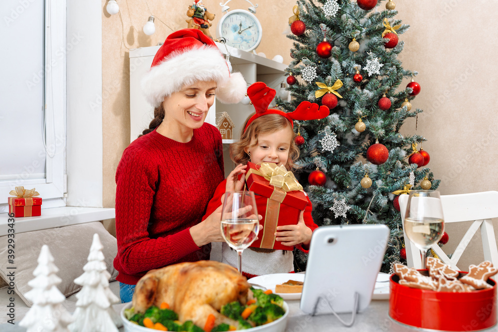 The girl received a gift at Christmas from his father and was very happy, the father sees her emotions on a video call The girl received a gift at Christmas from his father and was very happy, the father sees her emotions on a video call