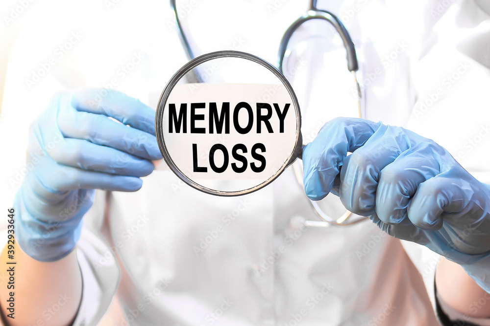 The doctor's blue - gloved hands show the word MEMORY LOSS - . a gloved hand on a white background. Medical concept. the medicine The doctor's blue - gloved hands show the word MEMORY LOSS - . a gloved hand on a white background. Medical concept. the medicine