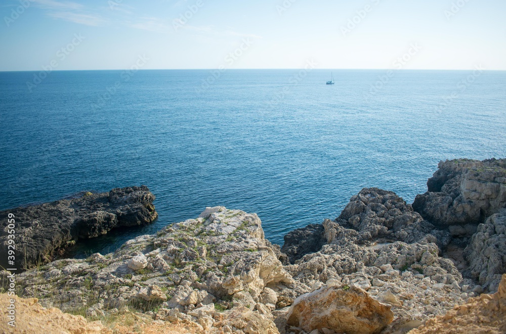 The sea to the horizon and blocks of stones in the foreground The sea to the horizon and blocks of stones in the foreground