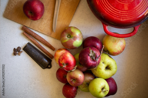 High angle view of apples and a pot on a counter at home photo