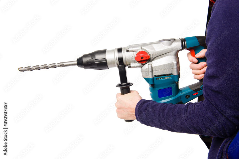 A man holding an electric rock drill